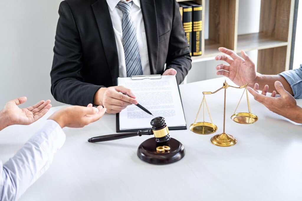 Couple discussing divorce at lawyer's office